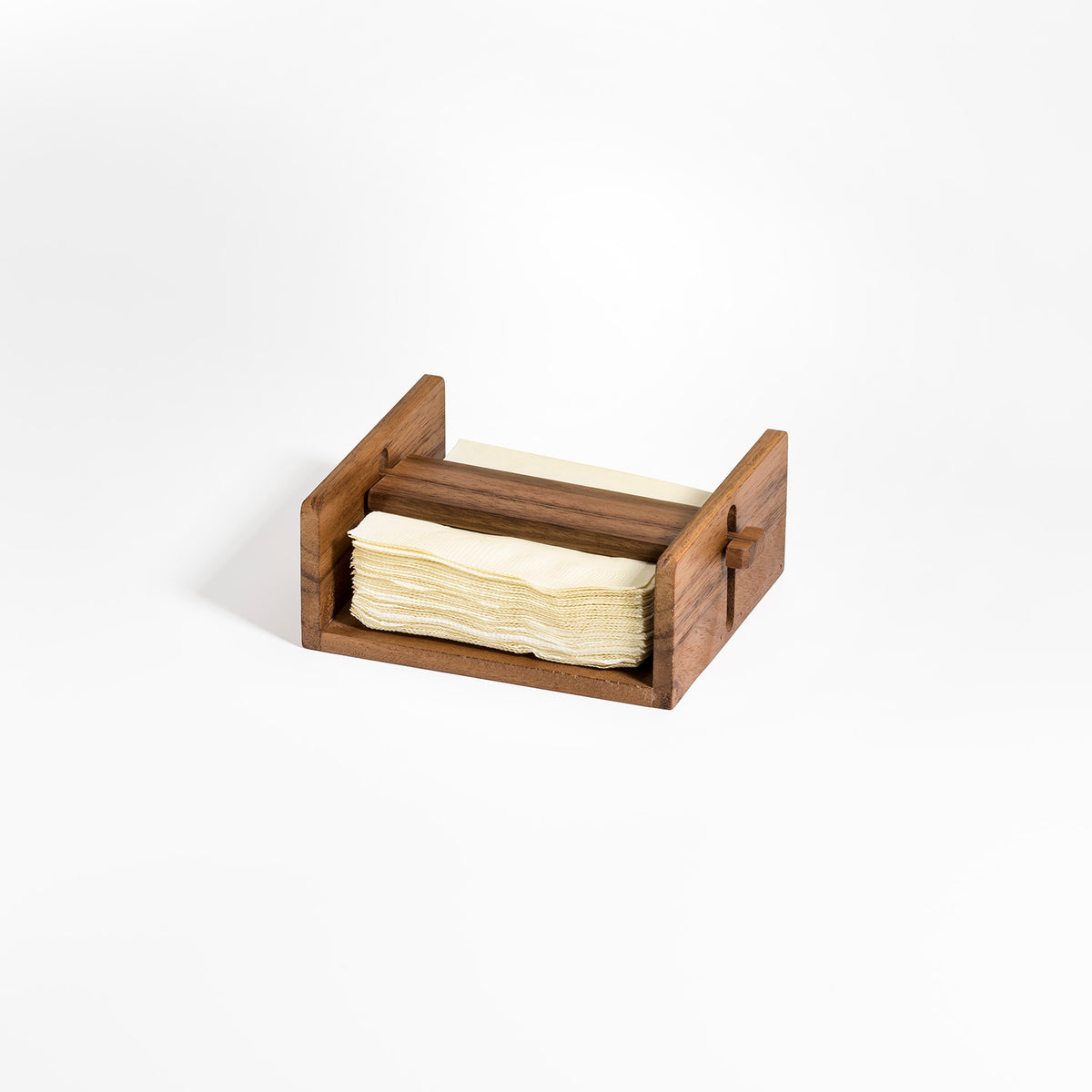 Wooden cocktail napkin holder filled with cream napkins for stylish entertaining from DC Kalmar Home in the Home and beyond collection