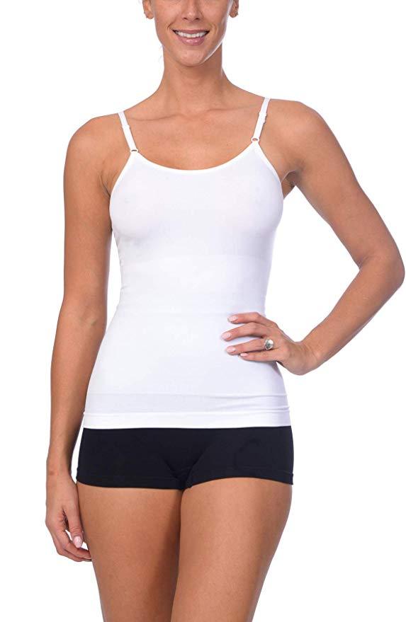 Woman modeling a white seamless shaping camisole with adjustable straps and black shorts for comfortable tummy support from Body Beautiful Shapewear Athletics