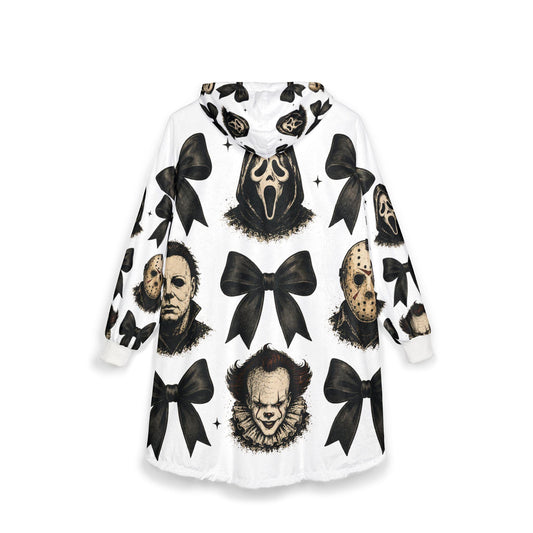 White hooded blanket featuring black bows and horror character portraits including Ghostface Michael Myers Jason Voorhees and Pennywise