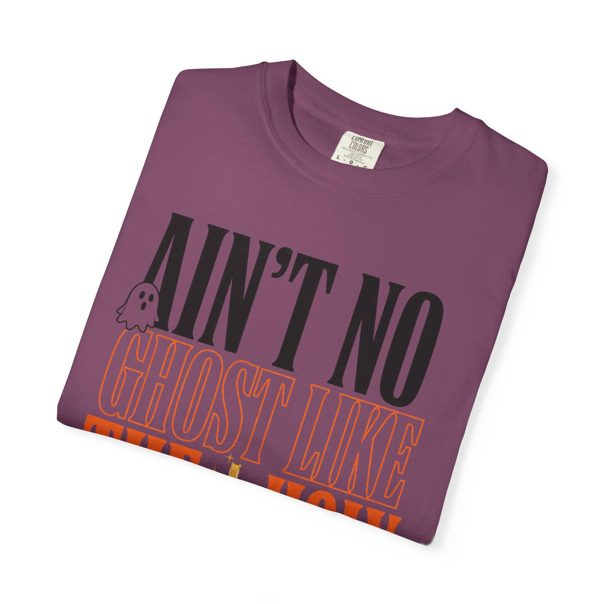 Purple graphic T-shirt with bold black and orange lettering reading Ain't No Ghost Like the Holy Ghost and a small ghost illustration
