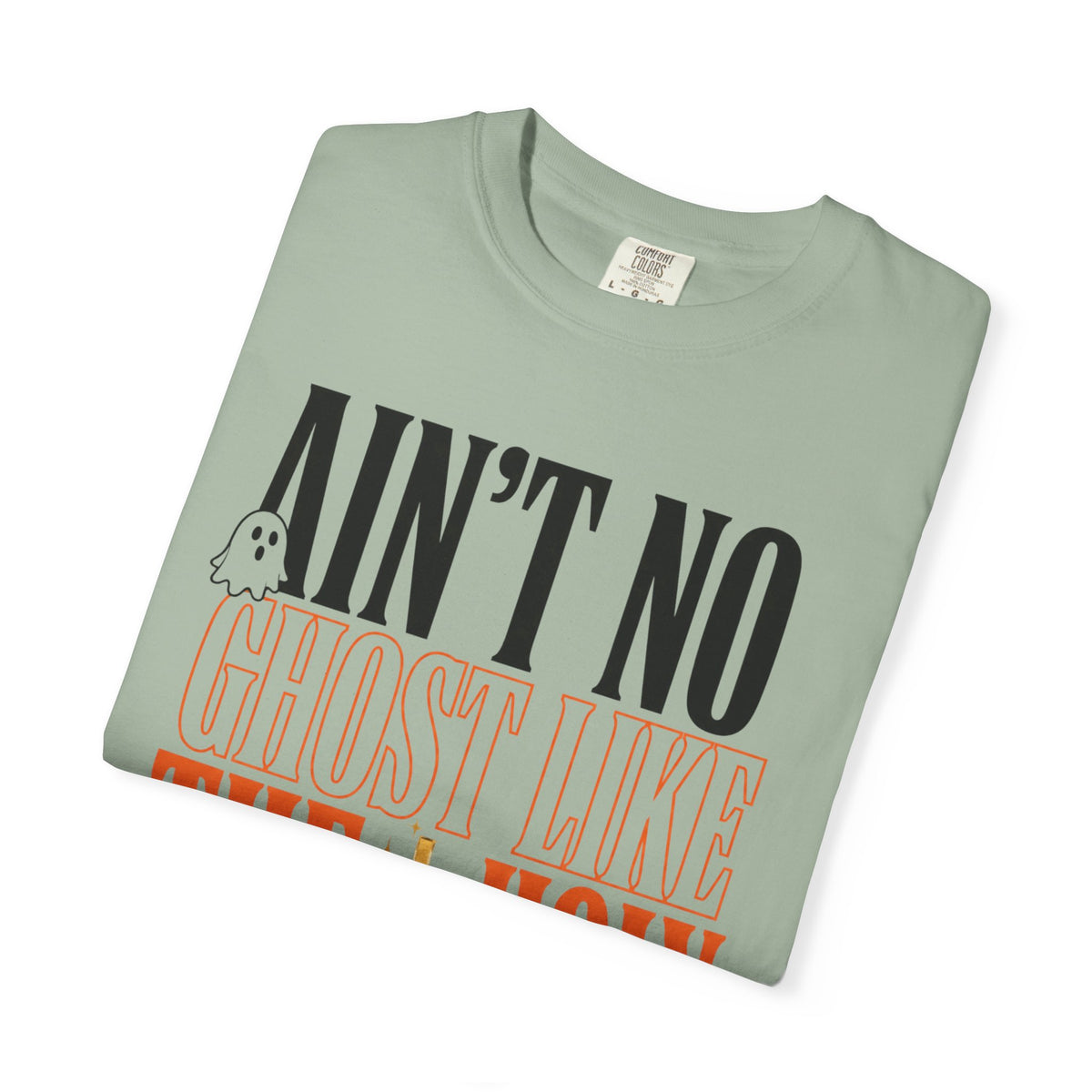 Sage green graphic T shirt with a playful ghost illustration and bold retro lettering reading Aint No Ghost Like for women's fashion lovers