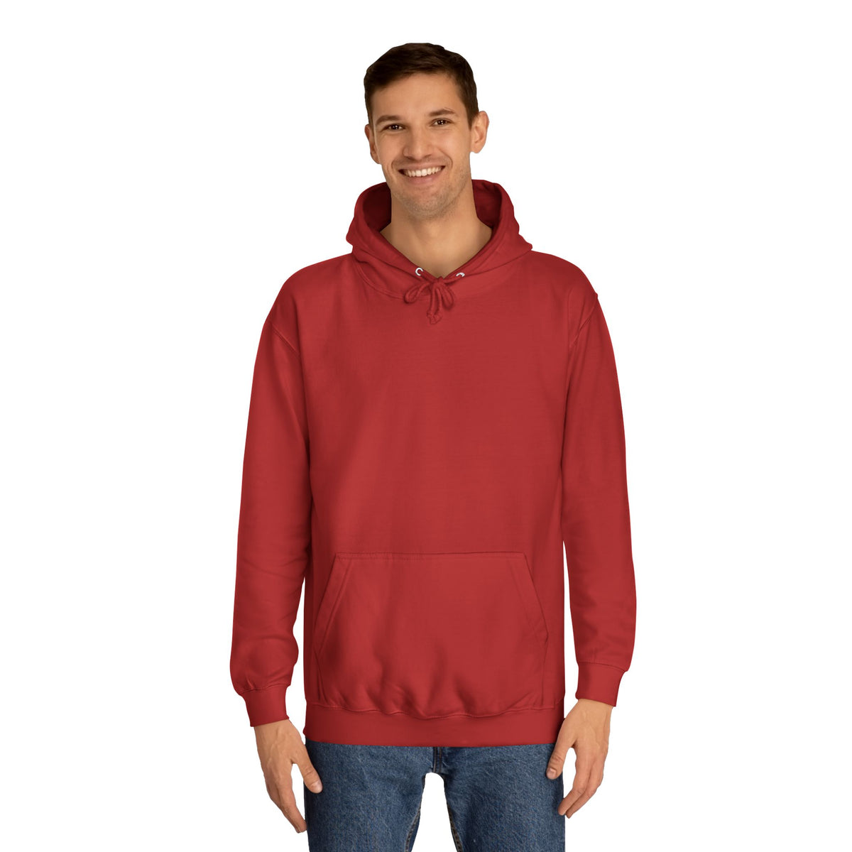 Smiling model wearing a solid red pullover hoodie with a drawstring hood ribbed cuffs and a spacious kangaroo pocket styled with blue jeans