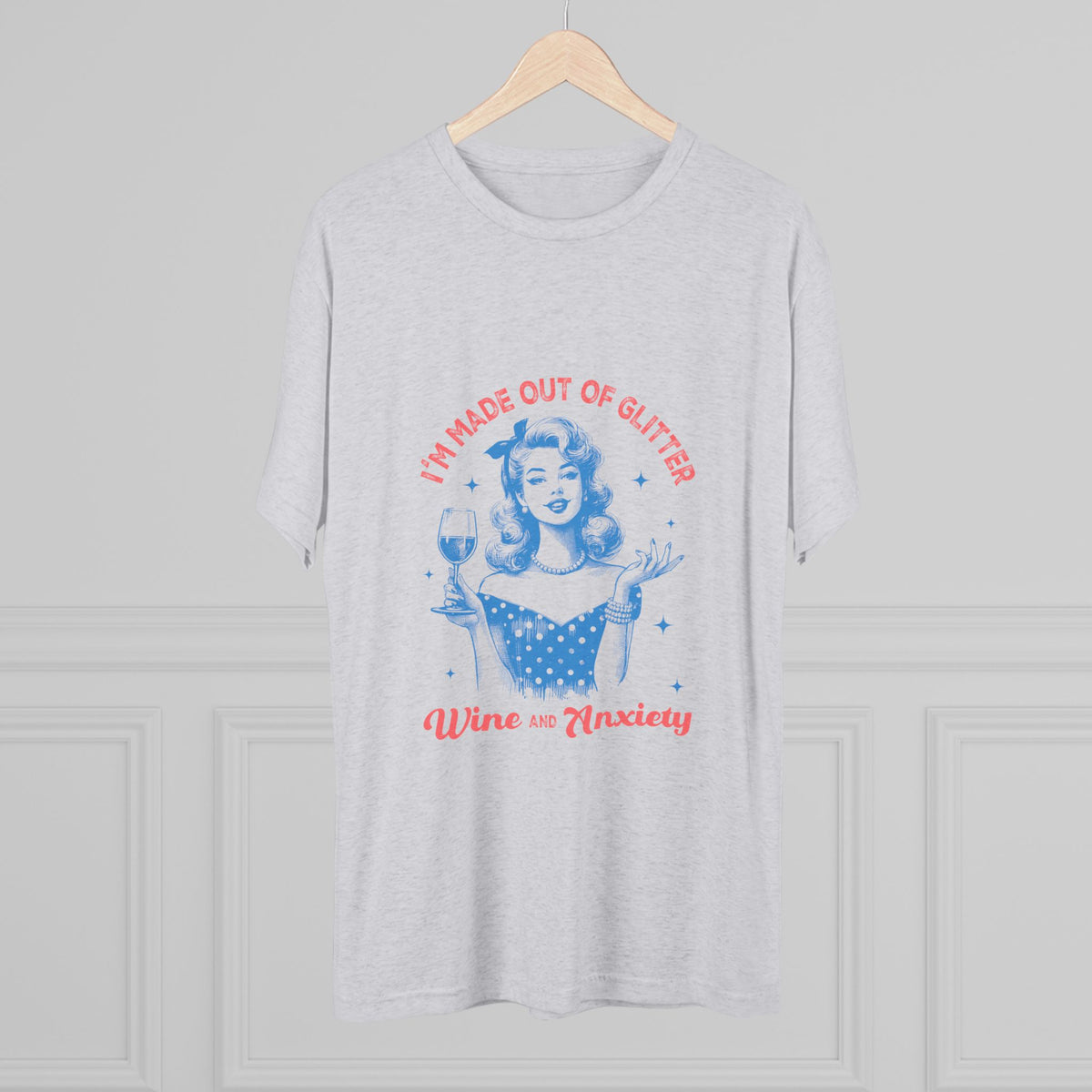 Light gray womens graphic tee on a hanger featuring a retro pinup woman with a wine glass and playful glitter wine and anxiety lettering
