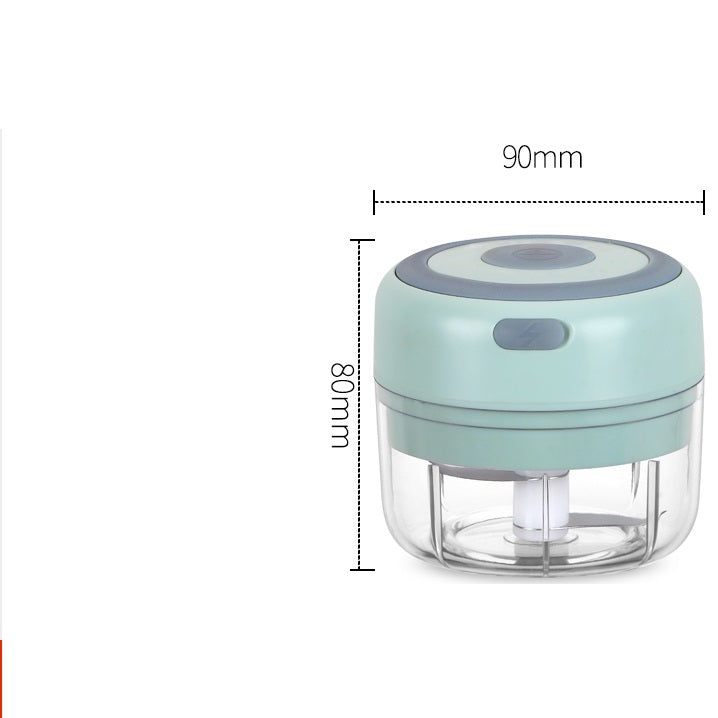 Compact mint green electric garlic chopper with a clear bowl, top button, and visible stainless steel blade