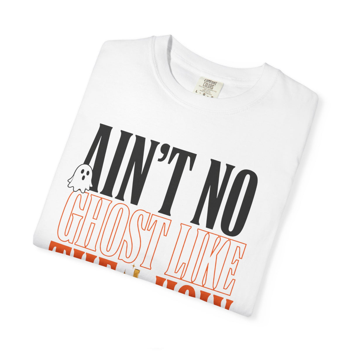 Folded white women's fashion graphic tee with bold black and orange text reading Ain't No Ghost Like and a small ghost illustration from Printify