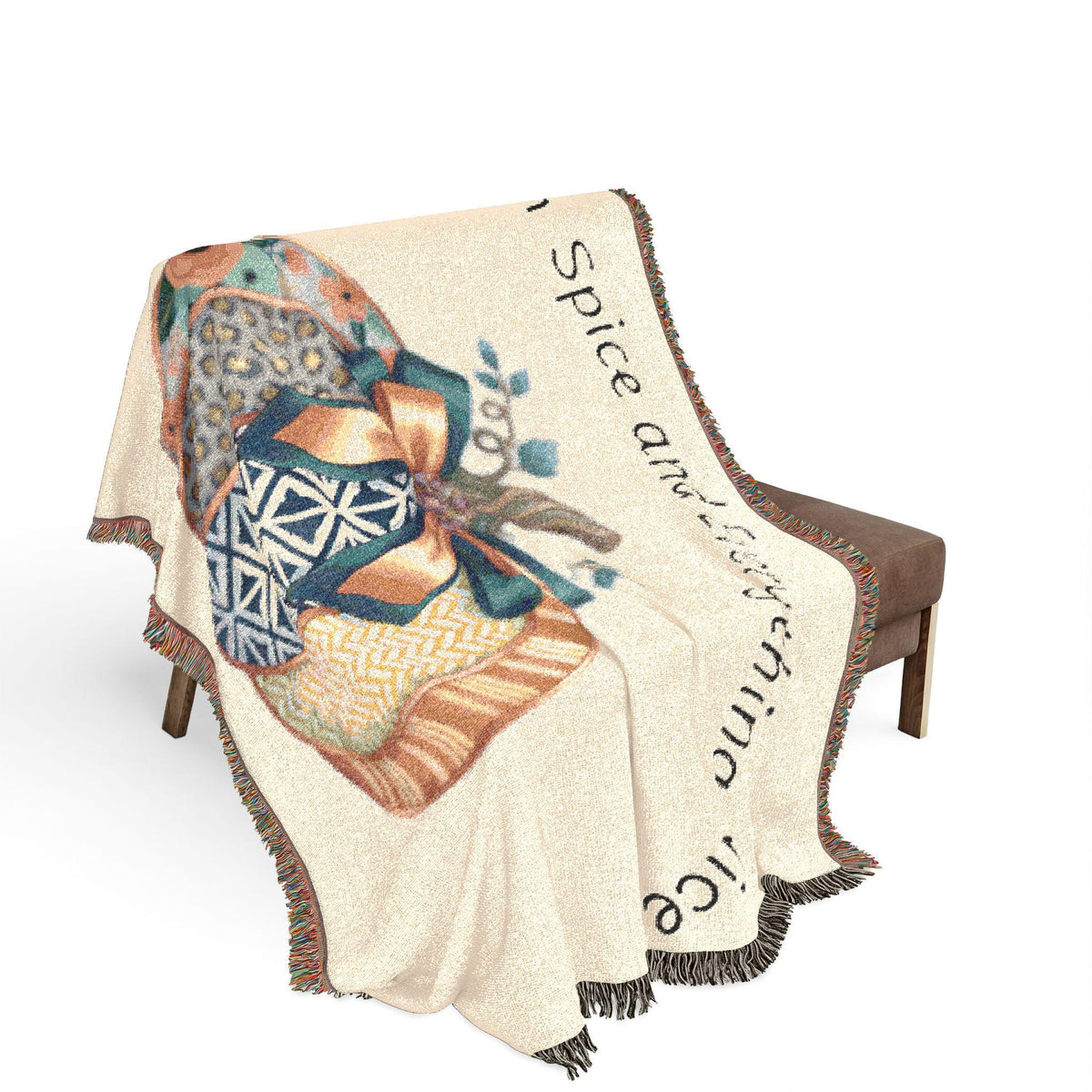 Woven autumn throw blanket draped over a bench with pumpkin spice artwork and fringe from Drizzle & Tizzle in Home & beyond