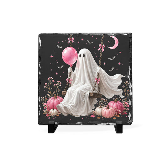 Handcrafted slate Halloween plaque featuring a whimsical ghost on a swing with a pink balloon, pumpkins, bats, flowers, and a crescent moon against a dark sky
