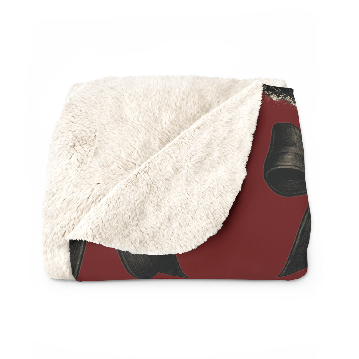 Folded vintage red sherpa blanket with a soft cream plush lining and dark horror mask graphics visible on the printed outer side