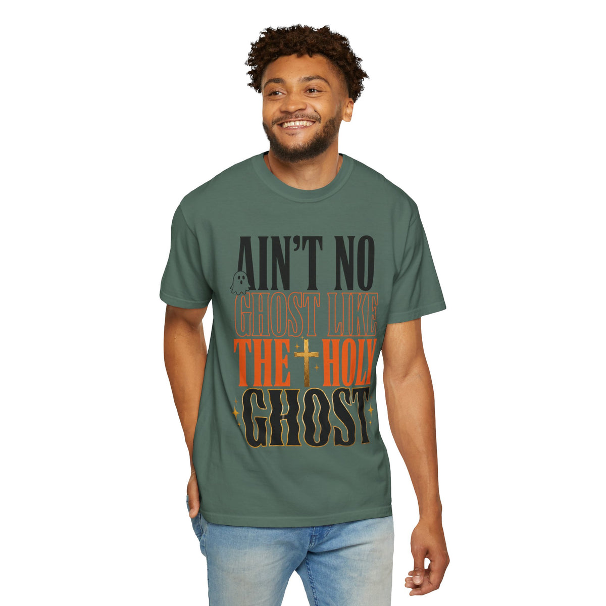 Man modeling a green graphic T shirt with bold vintage lettering that reads Aint No Ghost Like the Holy Ghost and a cross design on the front