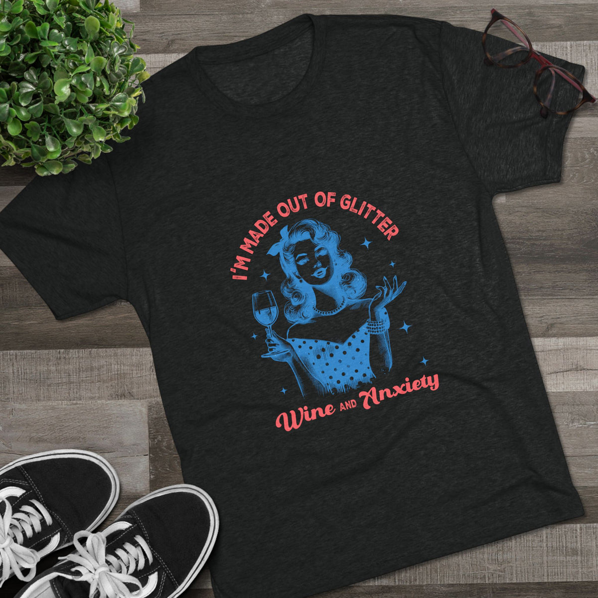 Black Printify graphic tee featuring a retro pinup woman holding a wine glass with colorful text reading Im Made Out of Glitter Wine and Anxiety
