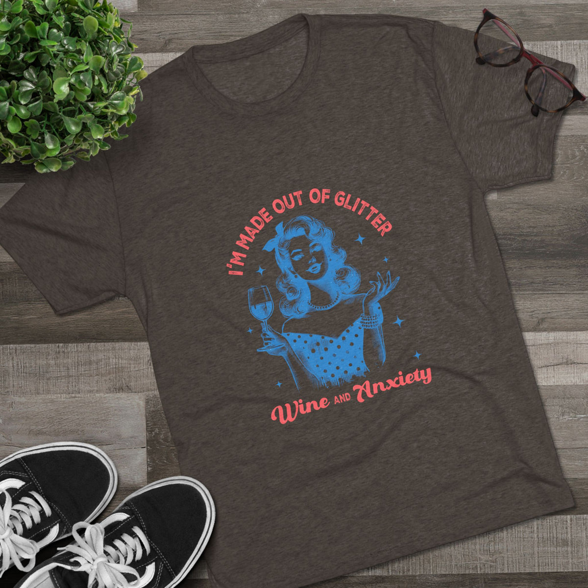 Printify dark charcoal graphic tee with a retro pinup woman holding a wine glass and playful lettering reading Im Made Out of Glitter Wine and Anxiety