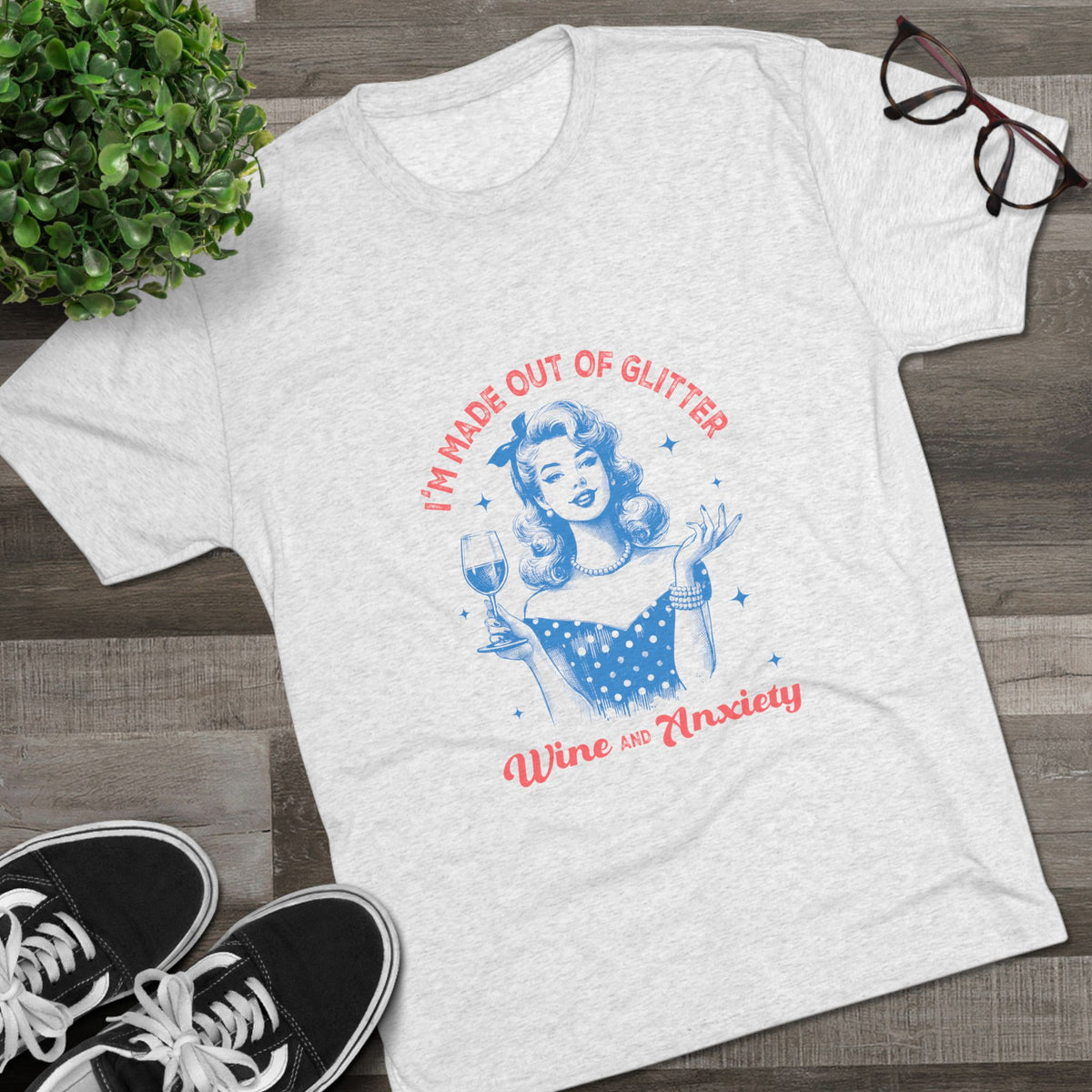 Light gray graphic tee featuring a retro pinup woman holding a wine glass with glitter wine and anxiety lettering in red and blue