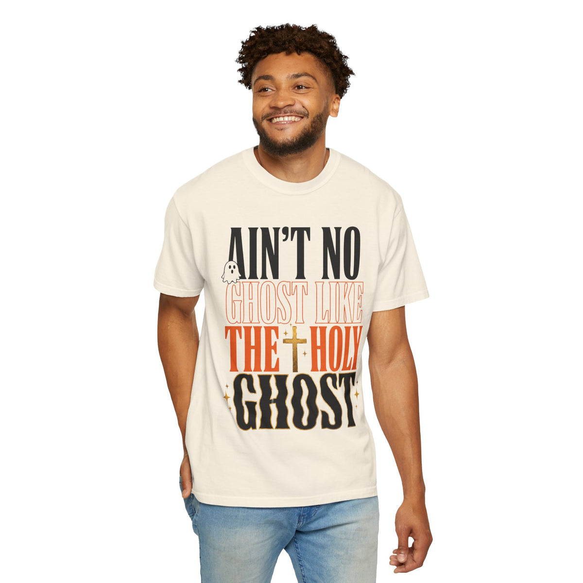 Smiling model wearing a cream graphic T shirt with bold Ain't No Ghost Like the Holy Ghost lettering and a cross design from Printify's vintage tee collection
