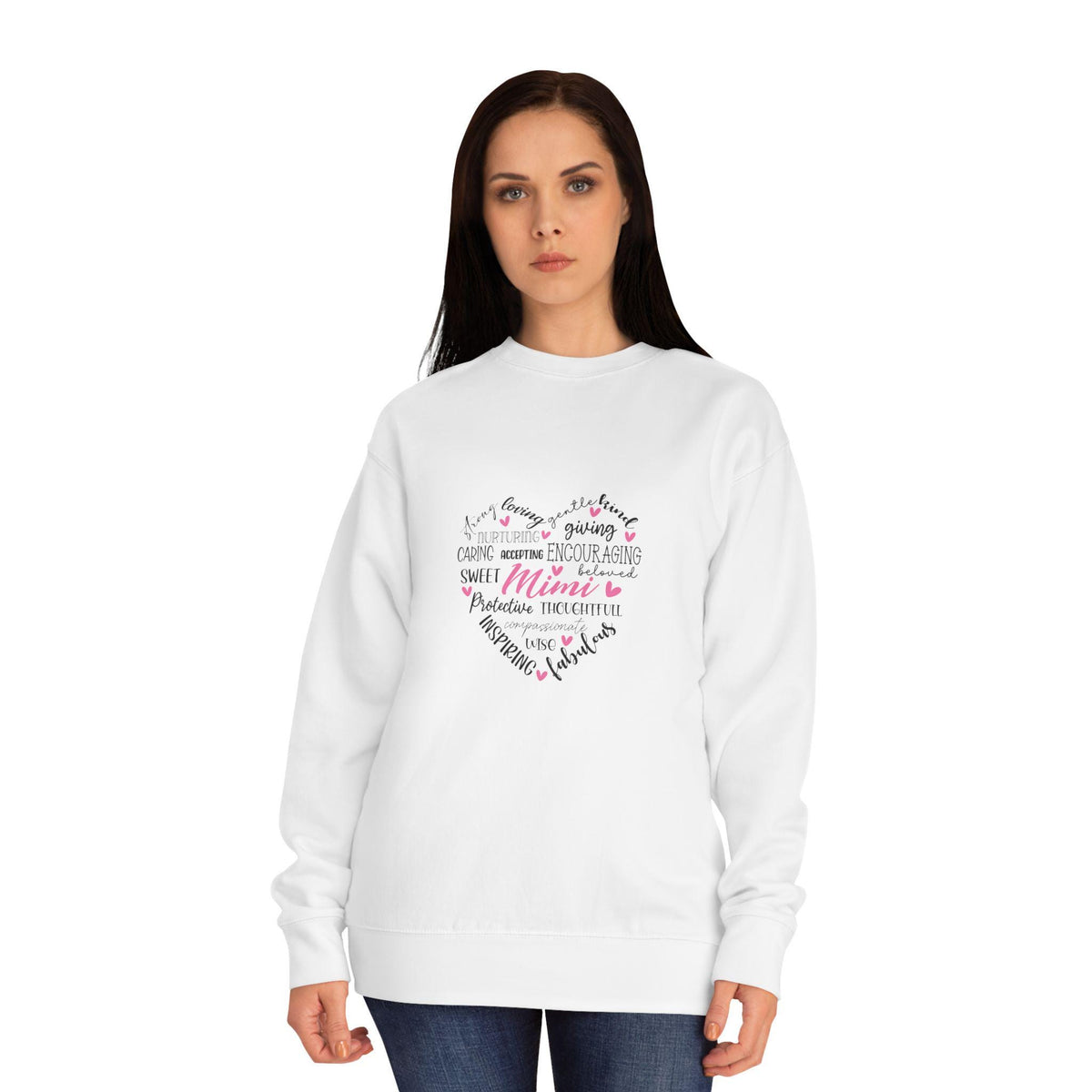 Woman modeling a white crewneck sweatshirt with a handwritten heart graphic featuring loving words and a Mama message, styled with dark jeans