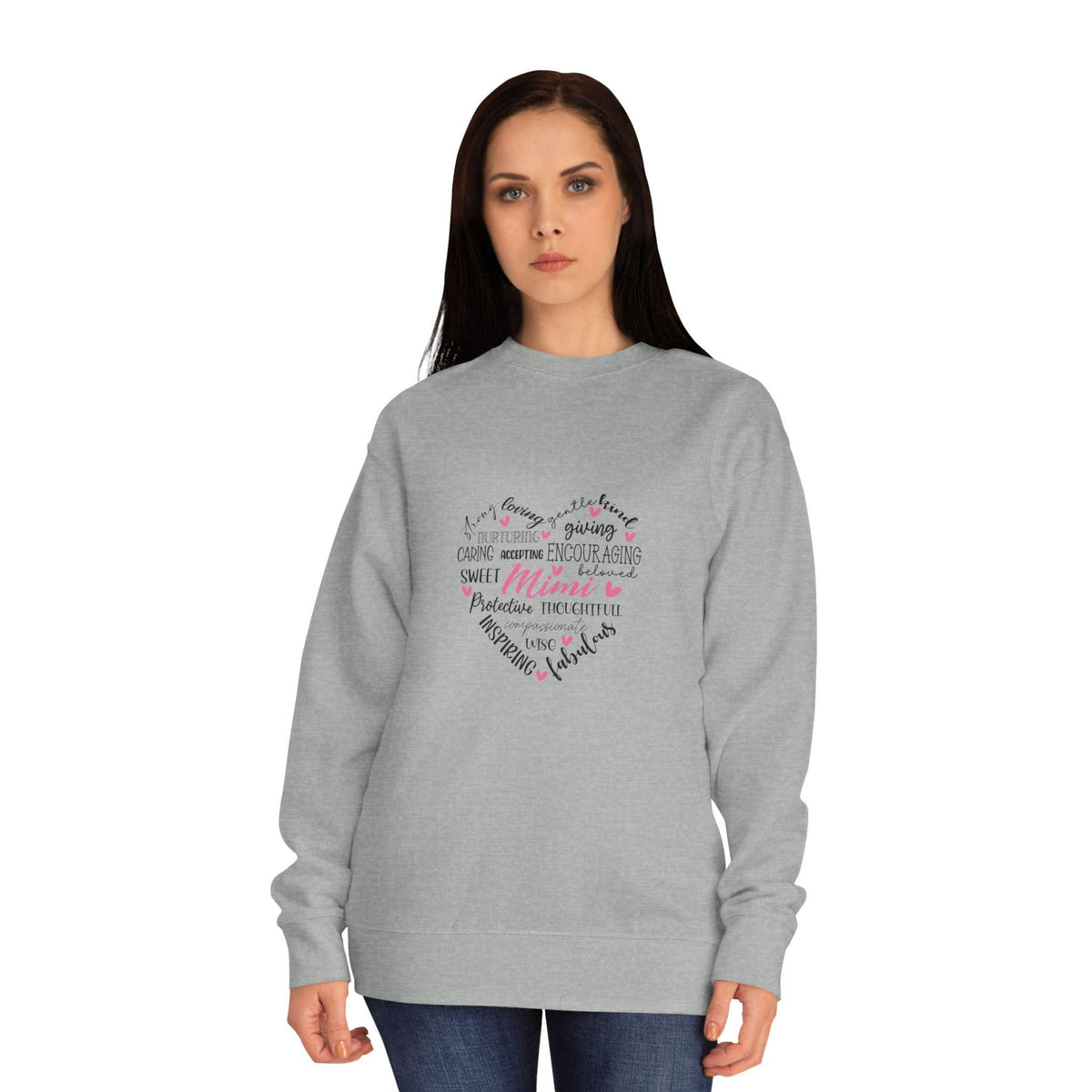 Woman modeling a gray crewneck sweatshirt with a multicolored handwritten heart shaped typography design featuring the word Mama on the front