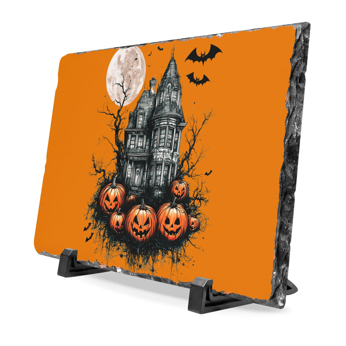 Halloween slate desk plaque featuring a haunted house under a full moon with bats and glowing pumpkins on an orange background and display stand
