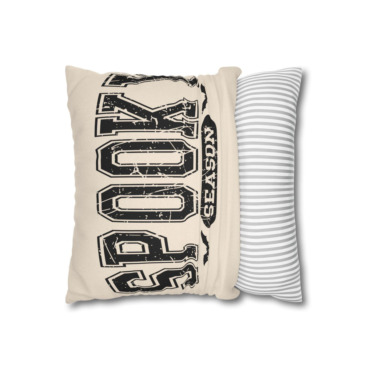 Cream square pillowcase with bold distressed black horror inspired lettering on the front and a gray striped reverse side displayed beside it
