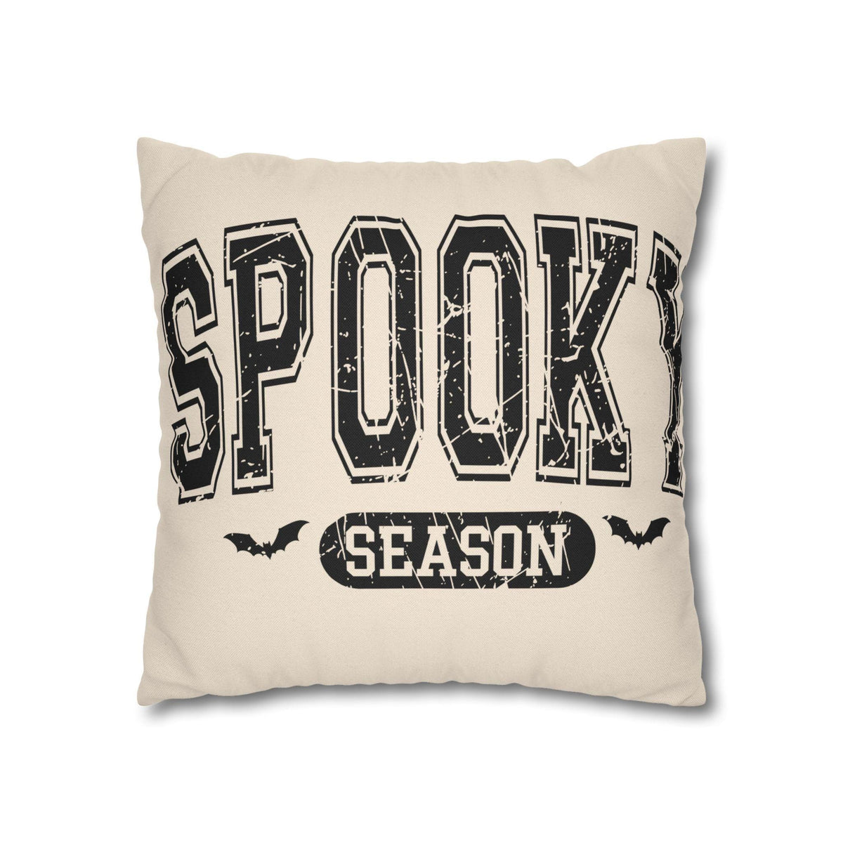 Square cream pillowcase featuring bold black Spooky Season lettering and flying bat silhouettes for seasonal home decor