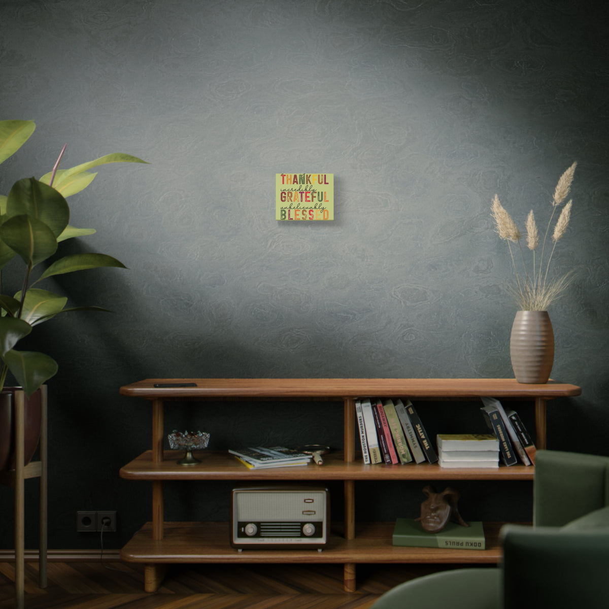 Thankful Grateful Blessed autumn wall canvas displayed above a wooden console in a cozy room with books plants and dried flowers