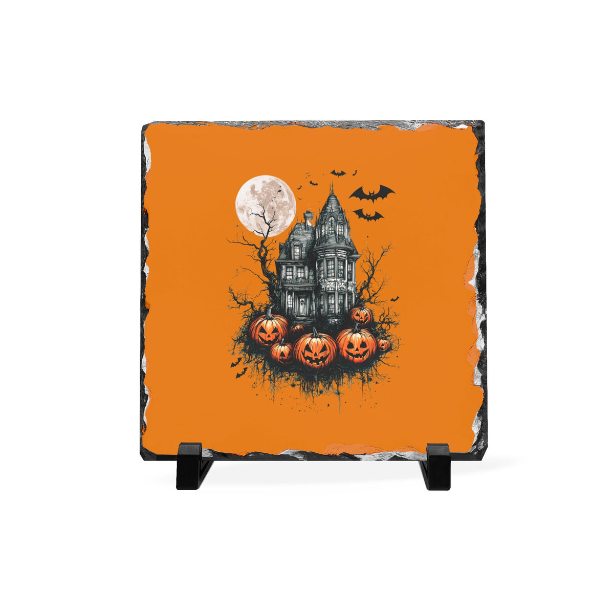 Haunted house Halloween slate desk plaque with full moon bats and pumpkins on an orange background displayed on a black stand for seasonal home decor