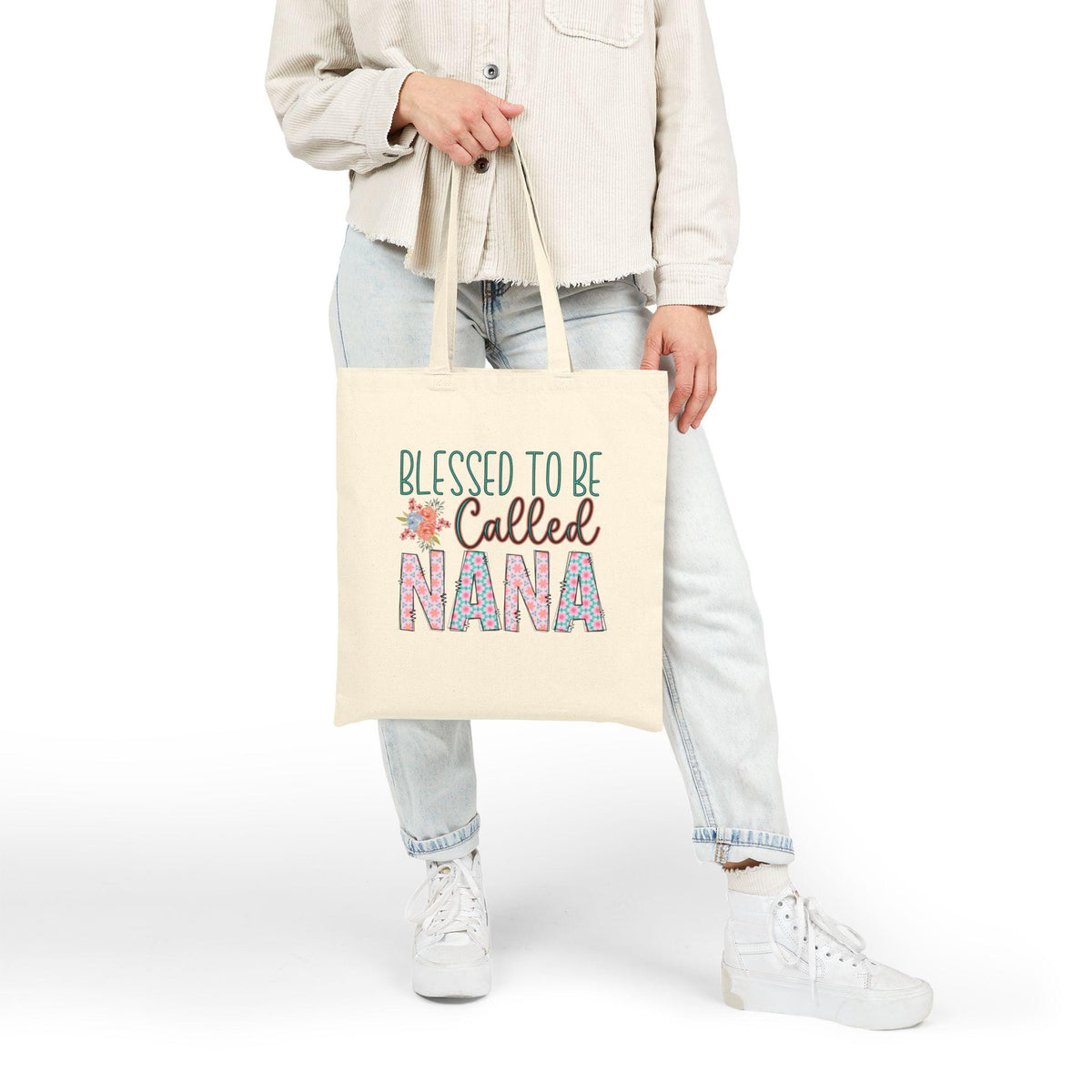 Cream cotton canvas tote bag with colorful Blessed to be Called Nana graphic, modeled with a casual womens fashion outfit and long shoulder handles