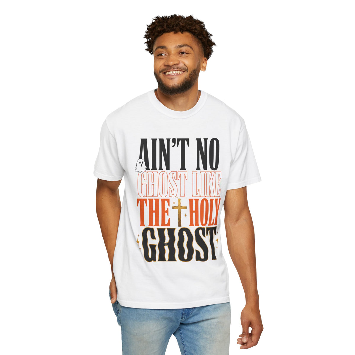 White graphic tee with bold black and orange lettering reading Ain't No Ghost Like the Holy Ghost worn by a smiling model on a plain background