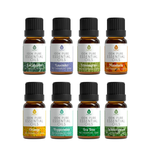 Eight amber essential oil bottles labeled Eucalyptus Lavender Lemongrass Mandarin Orange Peppermint Tea Tree and Wintergreen arranged in two rows