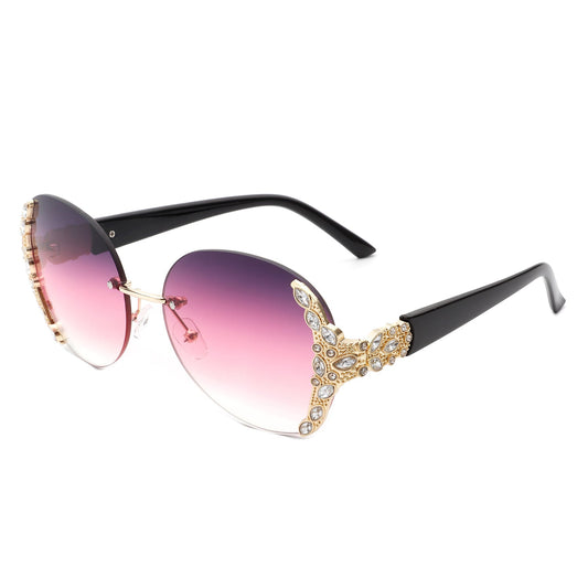 Oversized oval rimless sunglasses with pink gradient lenses black arms and ornate rhinestone embellishments by Cramilo Eyewear from the Jewelry collection