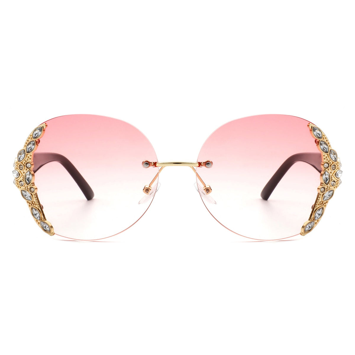 Oversized rimless sunglasses with pink gradient lenses and ornate rhinestone embellished sides for stylish womens fashion outfits