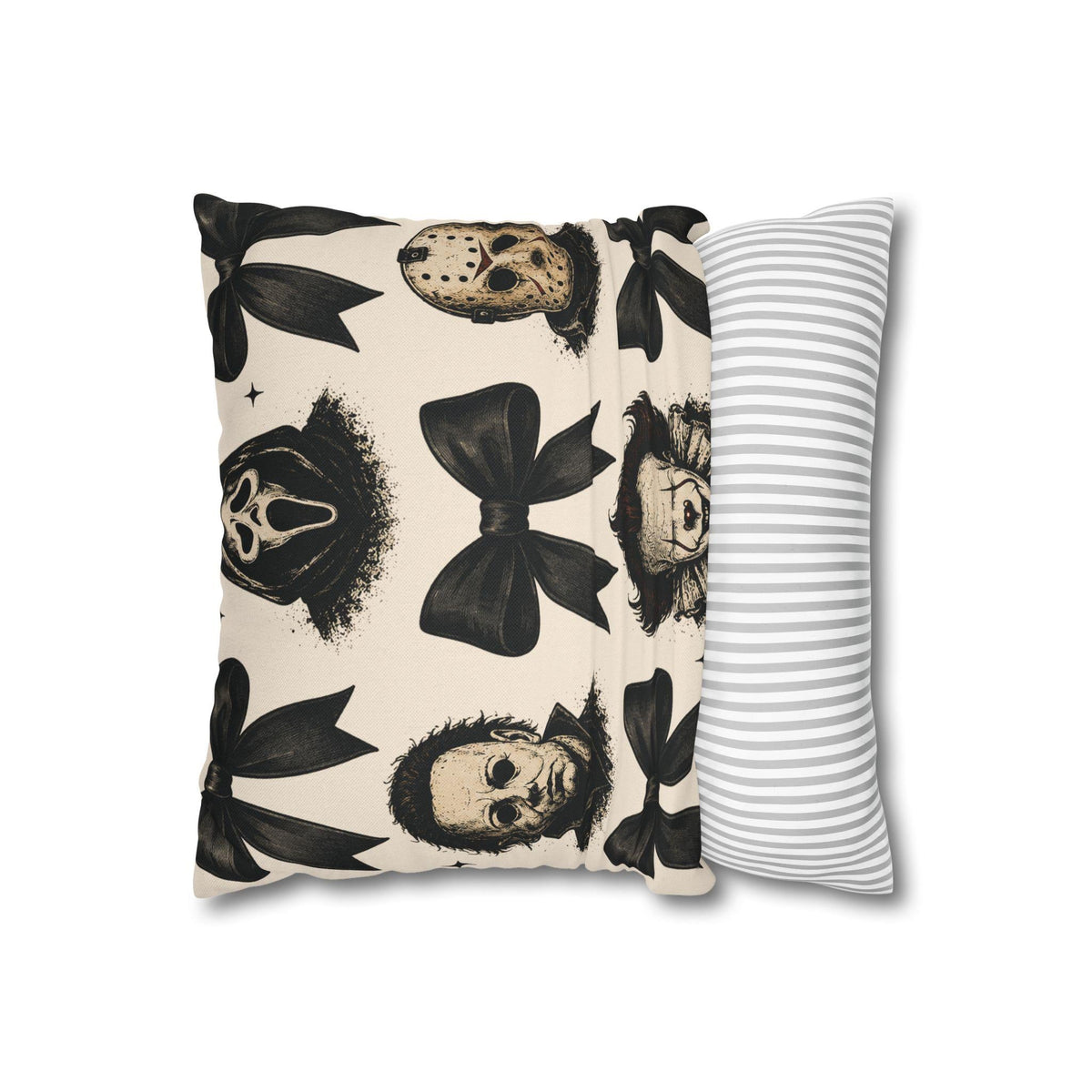 Square cream pillowcase featuring black horror masks bows and stars beside a gray striped pillow for distinctive seasonal home decor