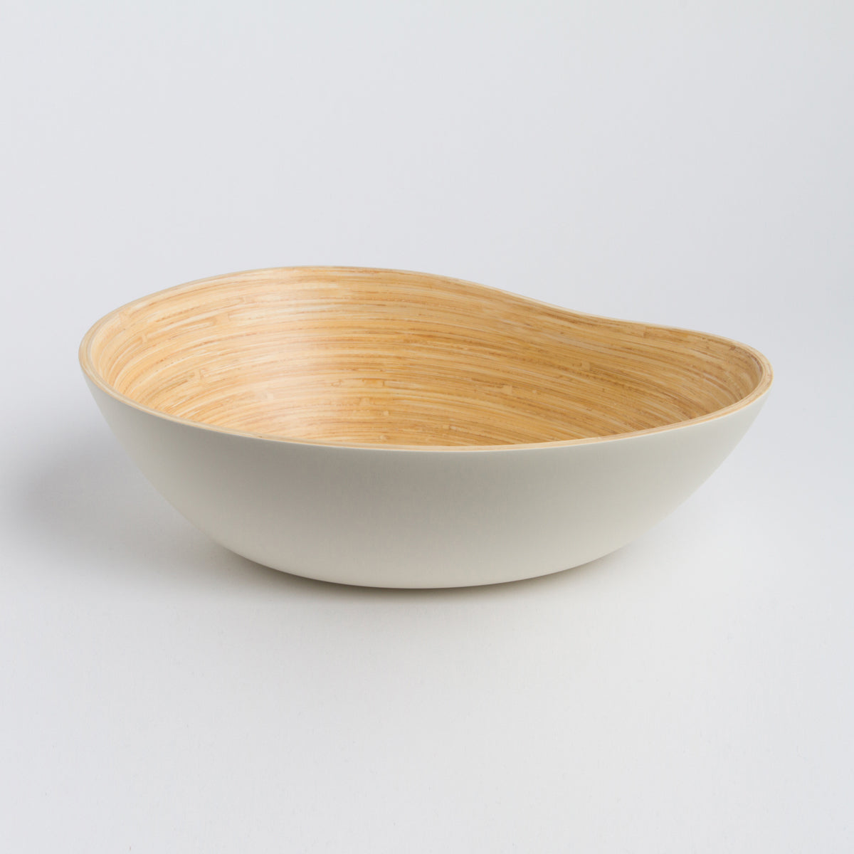 Bamboo mango shaped serving bowl with a warm natural grain interior and smooth cream exterior for serving or home decor by DC Bibol from Home and beyond