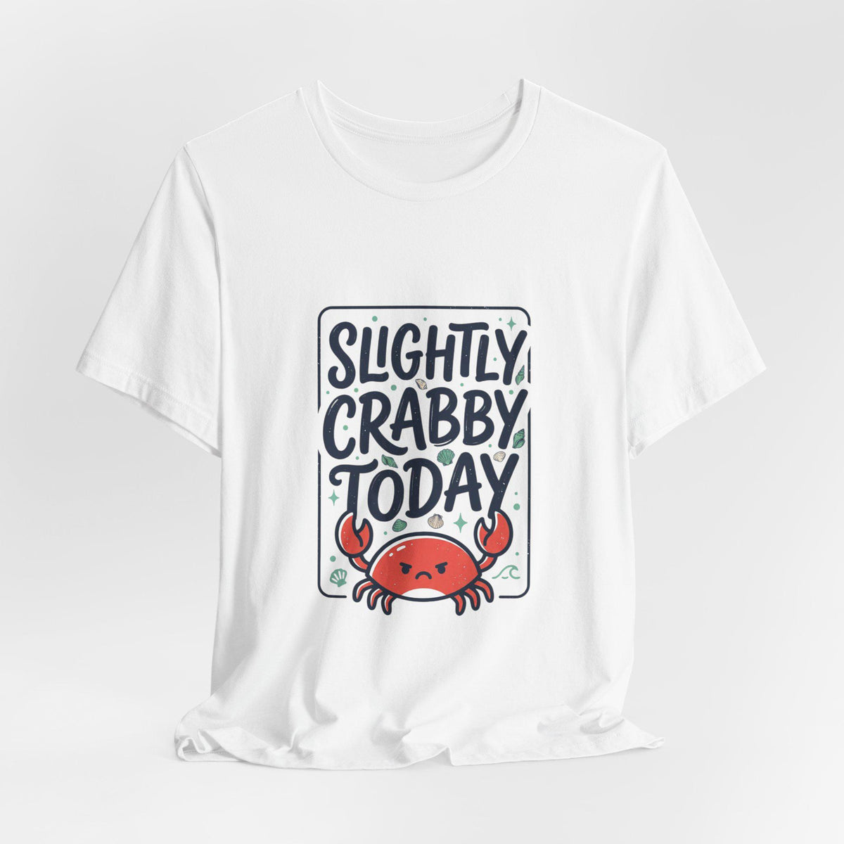 White graphic shirt featuring a cartoon crab and the phrase Slightly Crabby Today in playful lettering with colorful coastal accents
