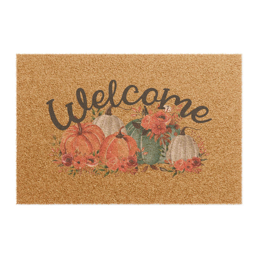 Autumn coir doormat featuring painted pumpkins faded florals and a hand lettered Welcome design from Drizzle and Tizzle for Home beyond seasonal home decor