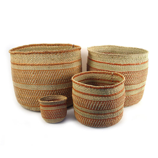 Set of four handwoven natural fiber Iringa baskets with auburn and neutral stripes in varied sizes for stylish home decor and storage
