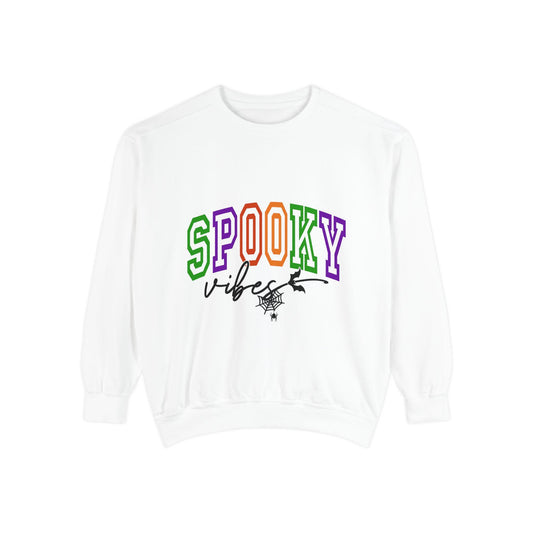 White sweatshirt with colorful varsity style SPOOKY vibes lettering and a playful spider web graphic for seasonal women’s fashion apparel