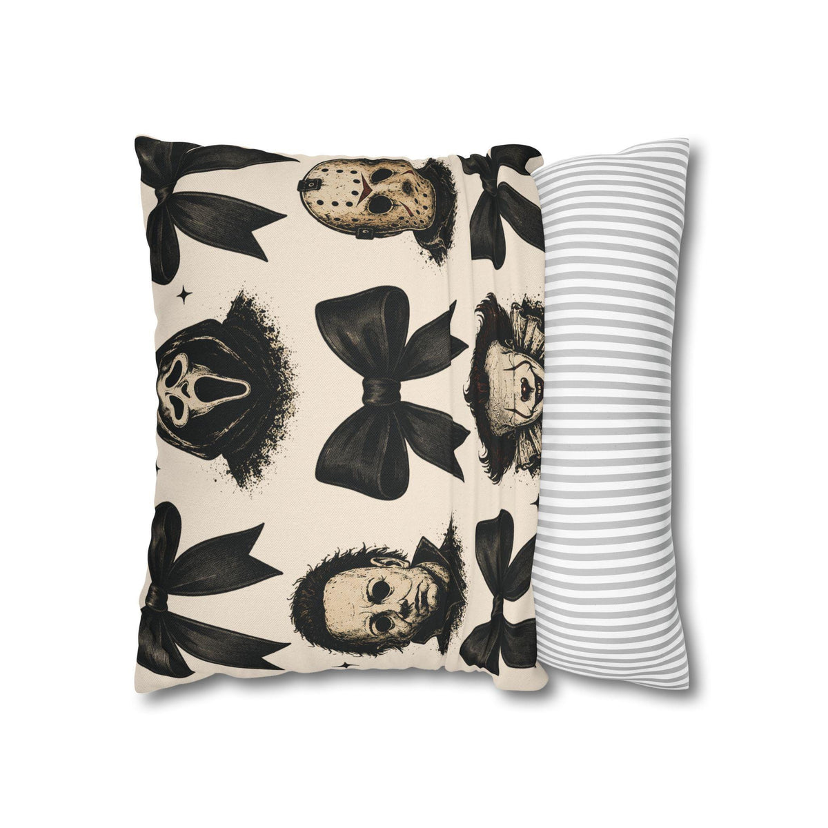 Cream pillowcase with black horror masks and bow motifs on a warm background beside a gray striped reverse side for spooky seasonal home decor