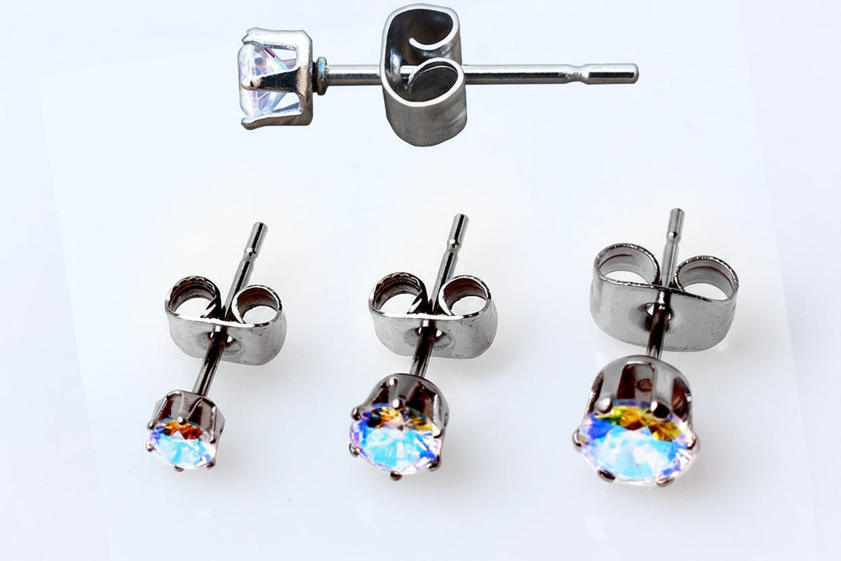 Aurora borealis round cubic zirconia stud earrings with rainbow shimmer and stainless steel butterfly backs displayed on a white background