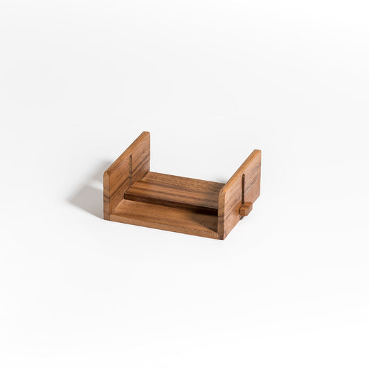 Wooden cocktail napkin holder with adjustable bar for neatly dispensing cocktail napkins in a home decor setting by DC-Kalmar Home