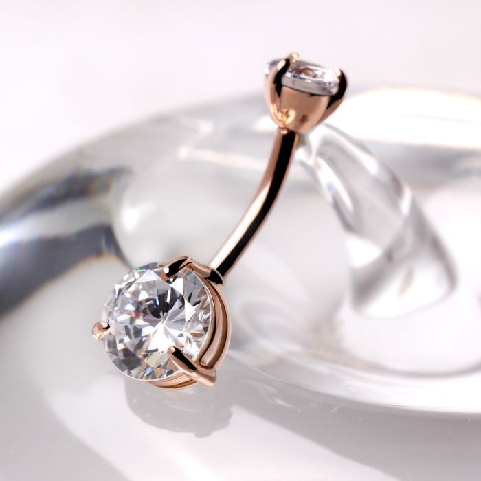 14kt rose gold navel ring with a large clear round cubic zirconia and prong set detail from Fashion Hut Jewelry in the Jewelry collection