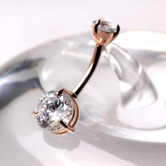 14kt rose gold navel ring with a large clear round cubic zirconia and prong set detail from Fashion Hut Jewelry in the Jewelry collection