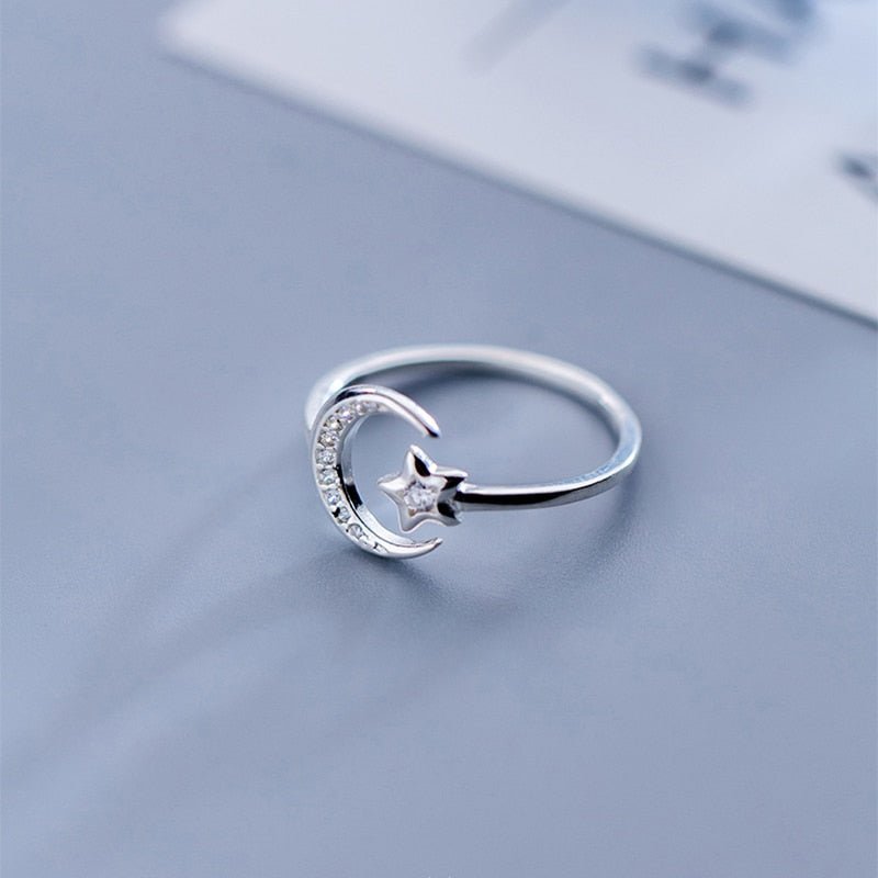 Adjustable sterling silver ring with sparkling crescent moon and star details from Fashion Hut Jewelry for New Arrivals Jewelry and womens jewelry collections