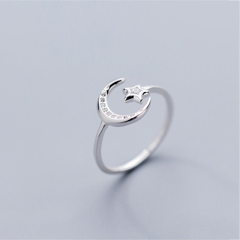 Silver sterling adjustable ring featuring a crescent moon and star with sparkling stones from Fashion Hut Jewelry for women's jewelry collections