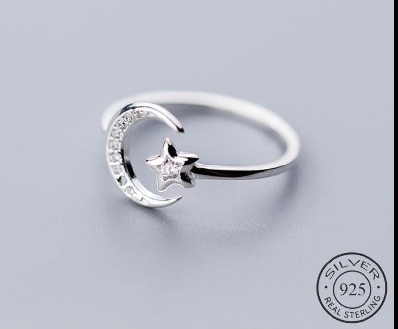 Adjustable 925 sterling silver ring with a crescent moon and sparkling star detail for women from Fashion Hut Jewelry in New Arrivals and Jewelry collections