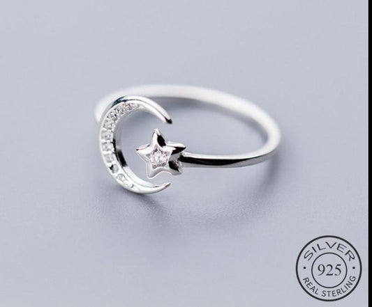 Adjustable 925 sterling silver ring with a crescent moon and sparkling star detail for women from Fashion Hut Jewelry in New Arrivals and Jewelry collections